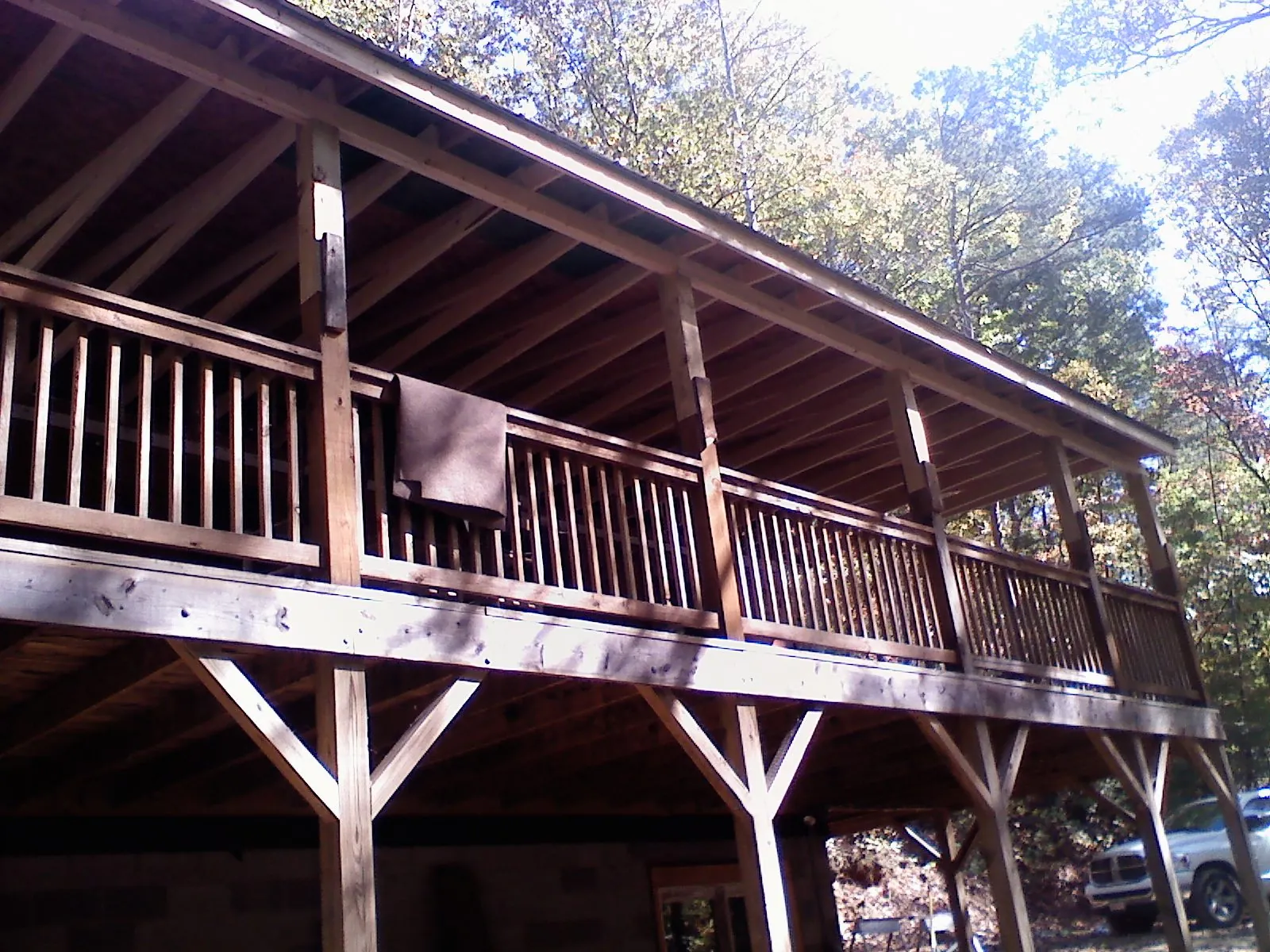 Timber framing under a new elevated porch and deck — Roof Leak Repair in Belen by Roofing Brothers